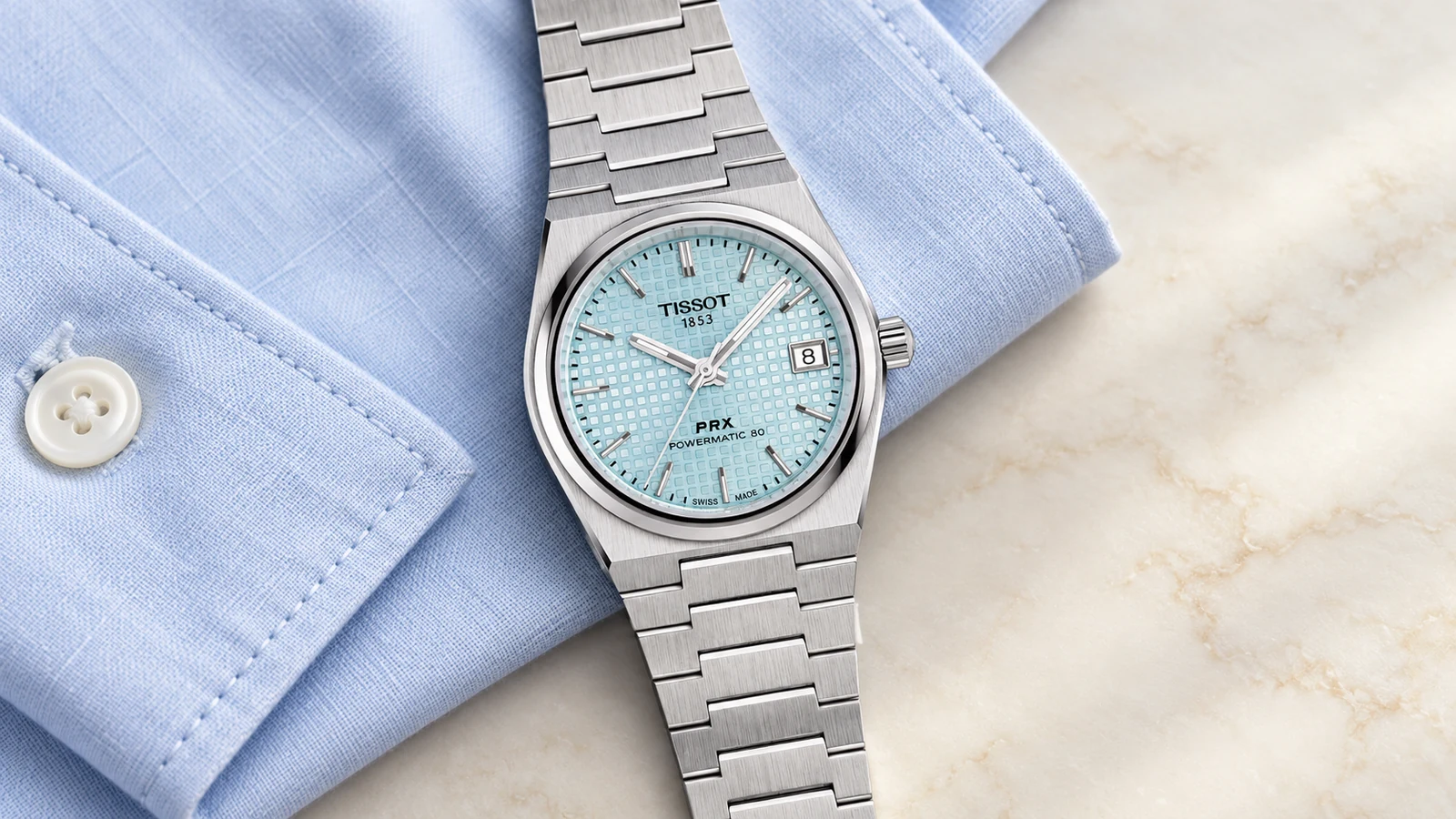 Компактные Tissot PRX T137.207.11.351.00: корпус 35 мм, голубой циферблат и стальной браслет